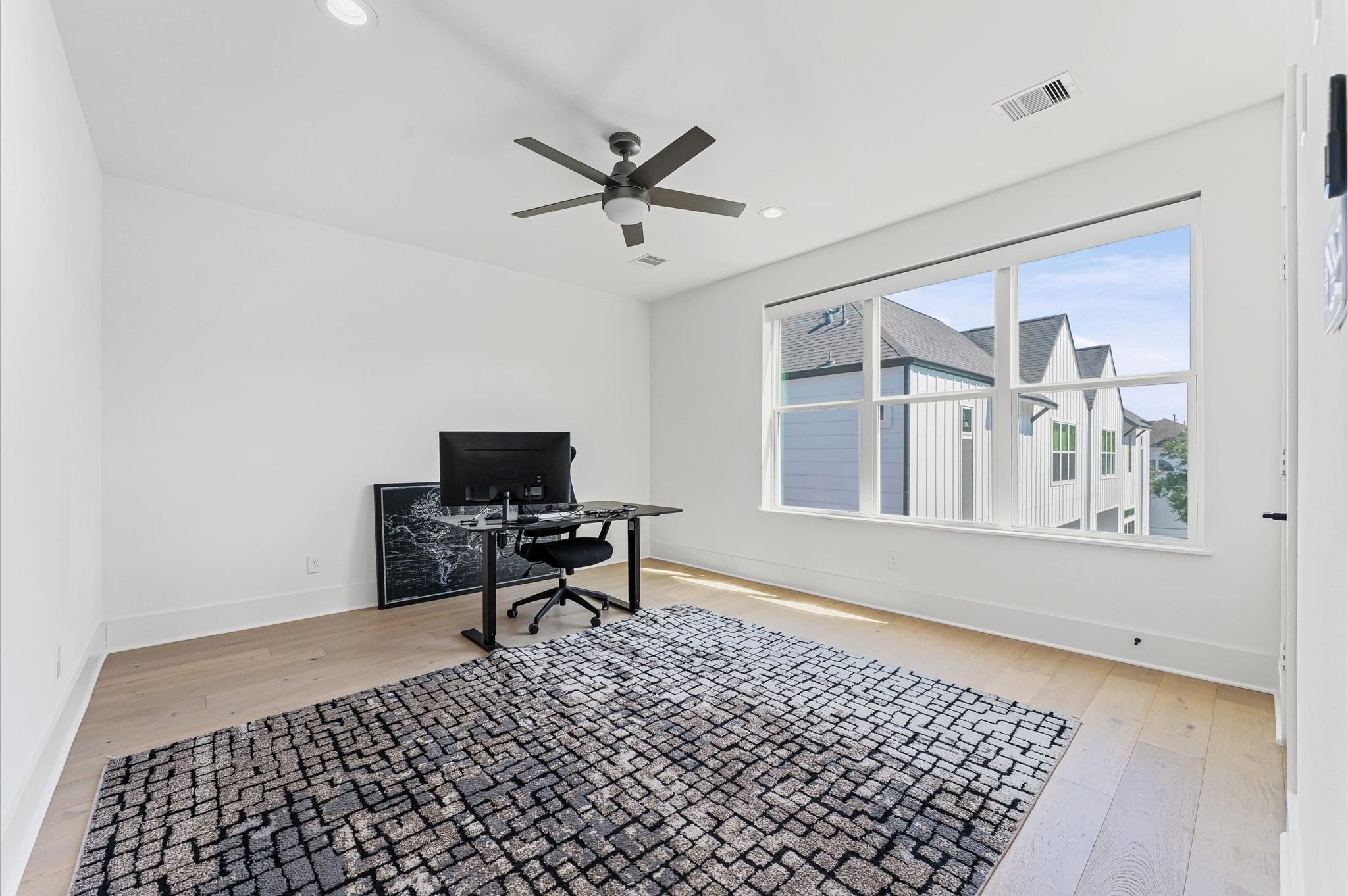 711 Lester Street Houston, TX 77007 - Photo 26 of 39 a living room with a couch and a table