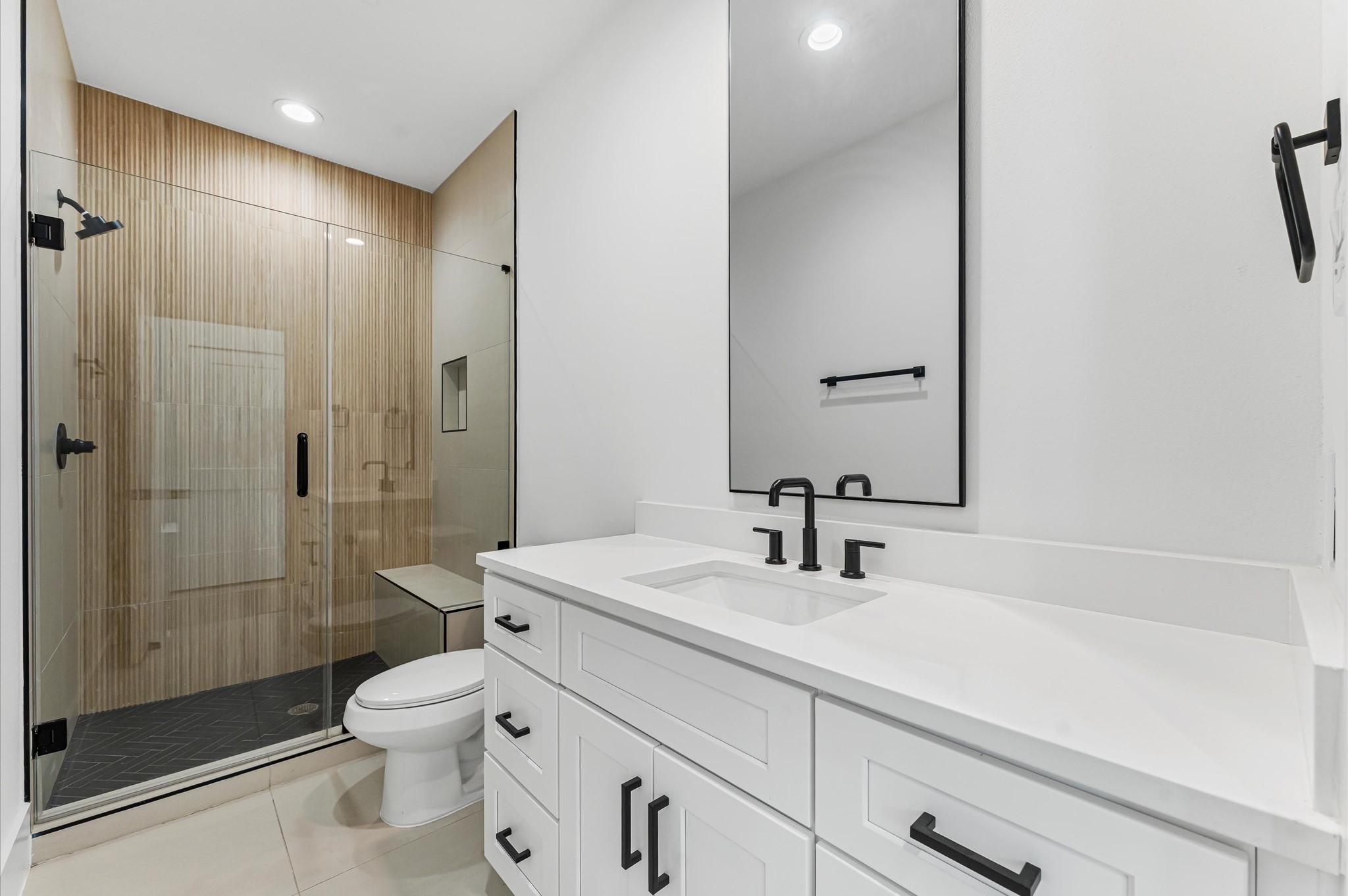 711 Lester Street Houston, TX 77007 - Photo 27 of 39 a bathroom with a sink a toilet and shower