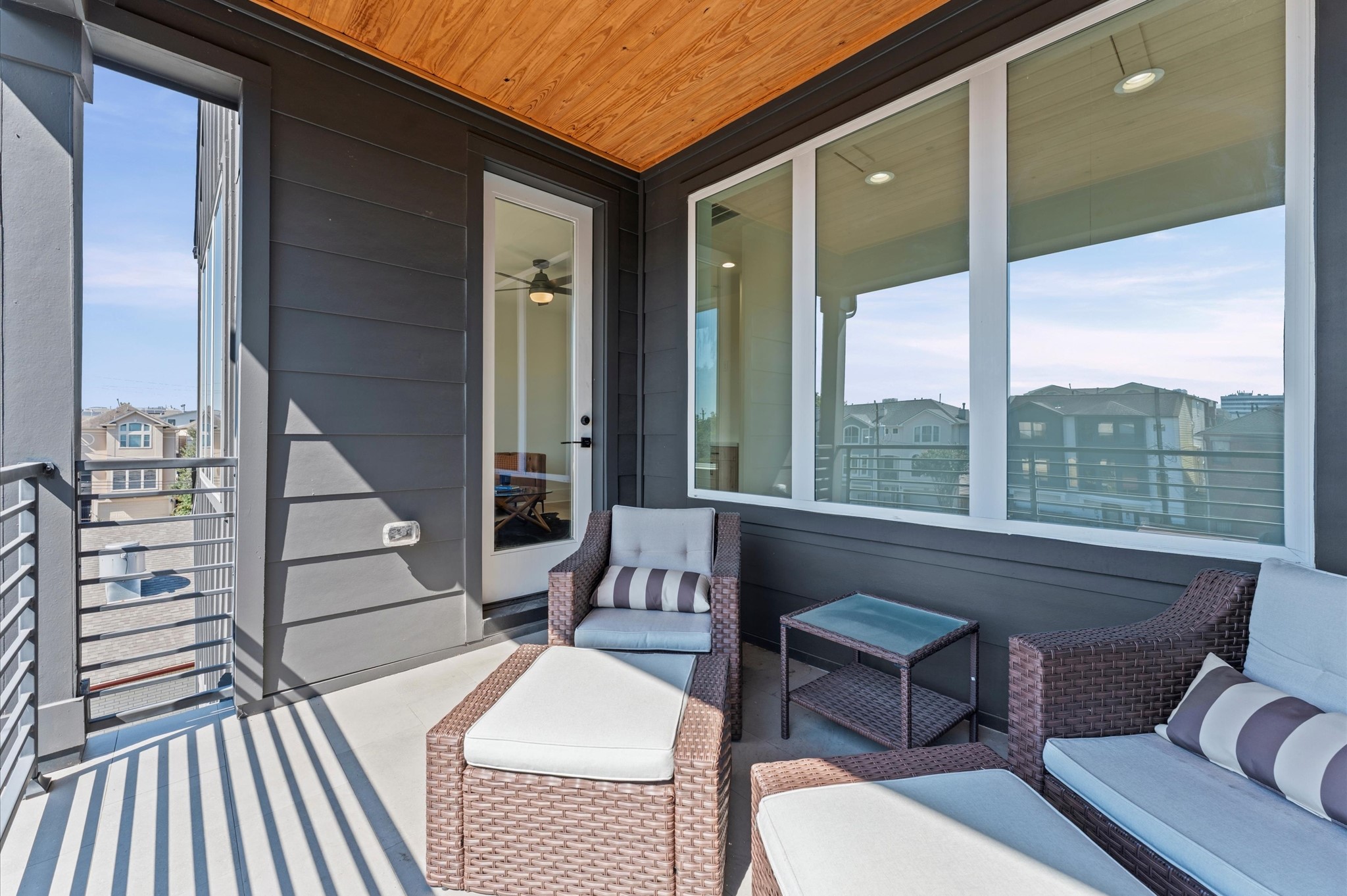 711 Lester Street Houston, TX 77007 - Photo 31 of 39 a balcony with furniture and wooden floor