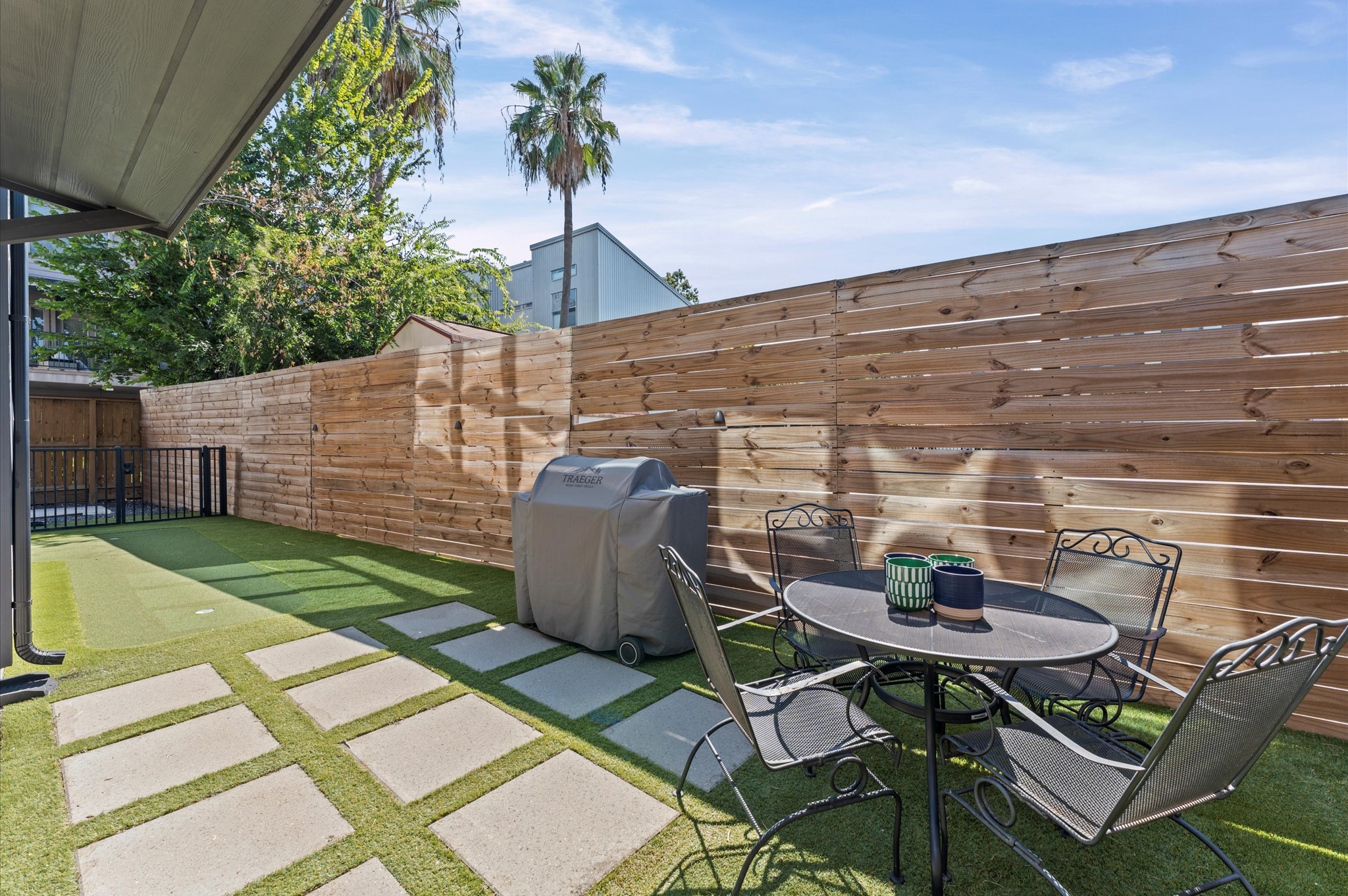 711 Lester Street Houston, TX 77007 - Photo 6 of 39 a backyard of a house with table and chairs