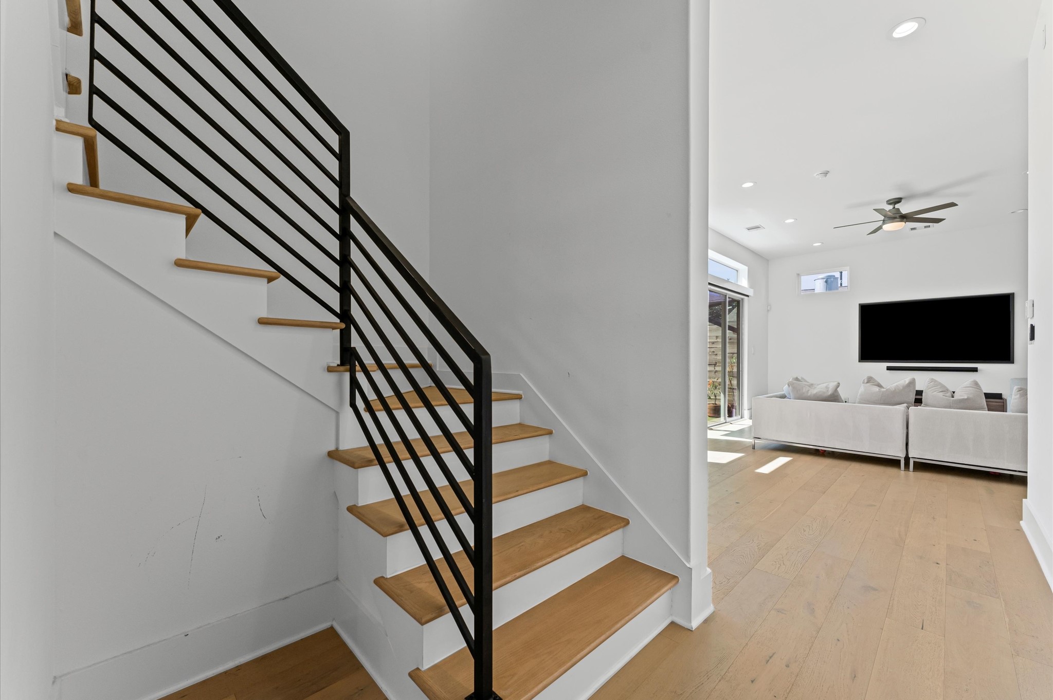 711 Lester Street Houston, TX 77007 - Photo 7 of 39 a view of a livingroom with furniture and wooden floor