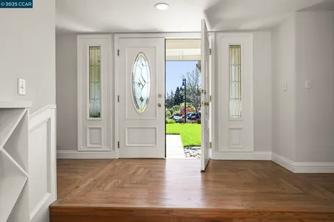 a view of livingroom with window and hardwood floor