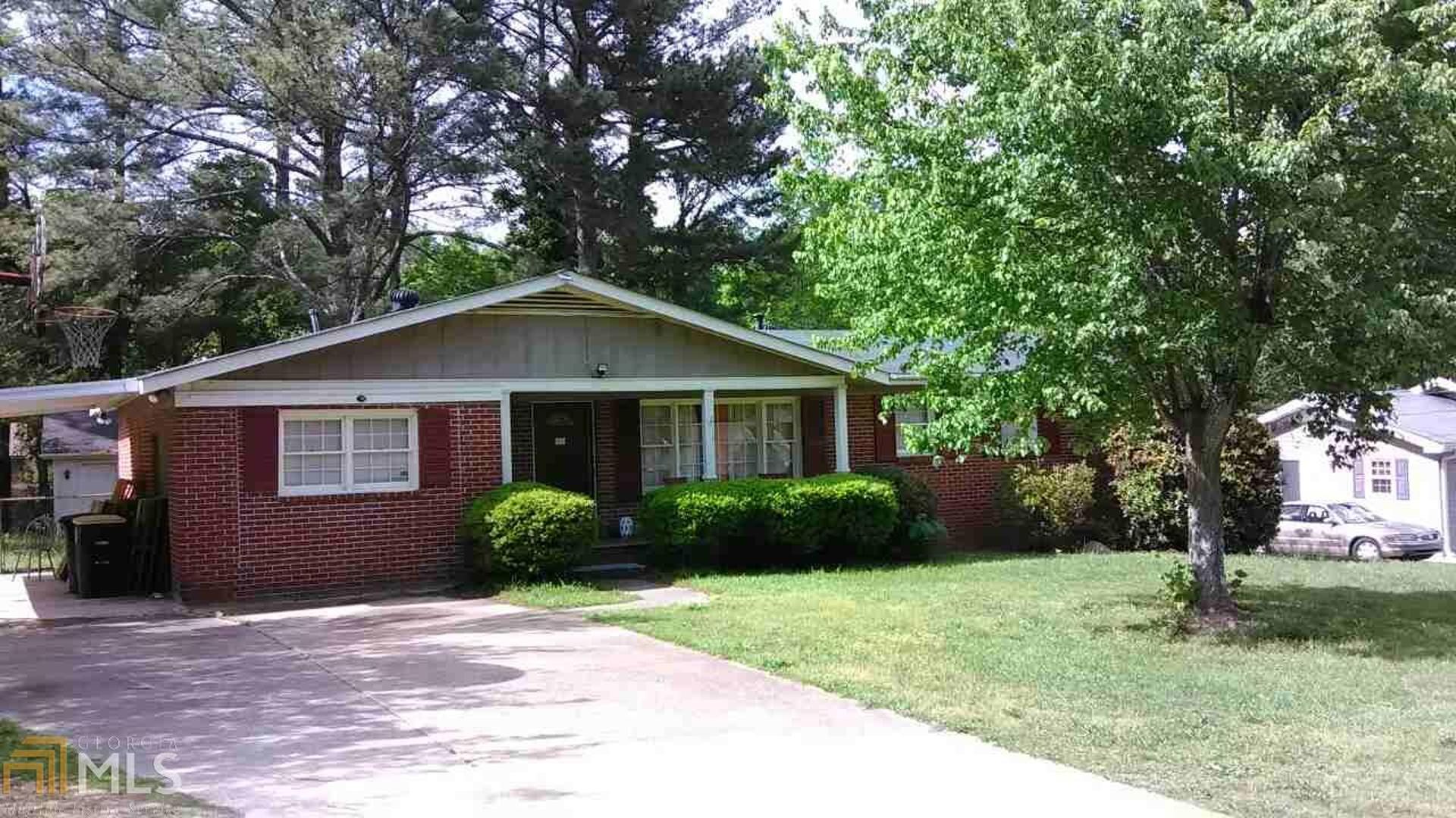 404 Billy Pyle Road Southwest, Unit 24 Rome, GA 30165 - Photo 1 of 1 a front view of a house with garden