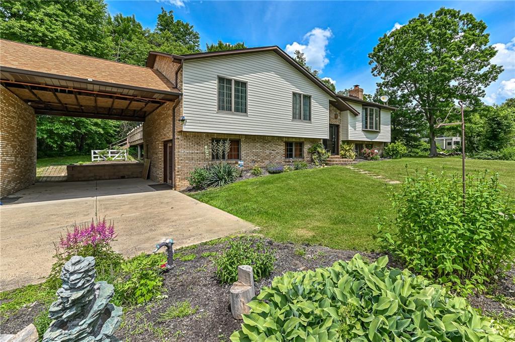 175 Dance Hall Road Apollo, PA 15613 - Photo 4 of 37 a front view of a house with a yard and garage