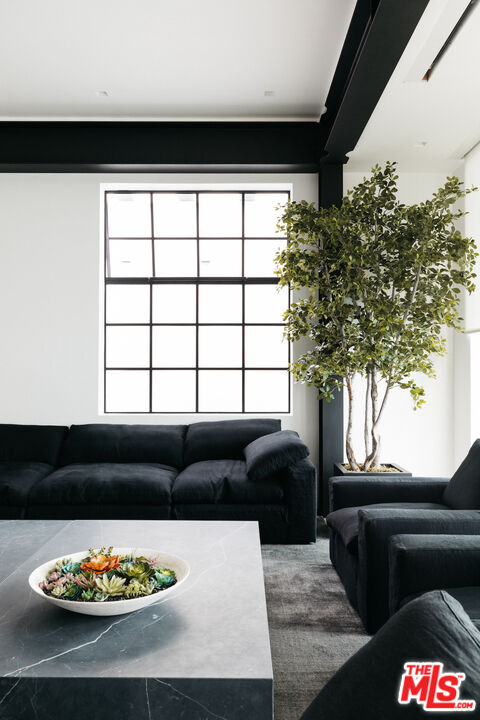 1346 Abbot Kinney Boulevard Venice, CA 90291 - Photo 15 of 18 a living room with furniture and a large window