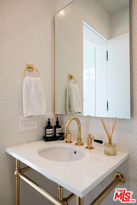 1346 Abbot Kinney Boulevard Venice, CA 90291 - Photo 17 of 18 a bathroom with a sink and a mirror