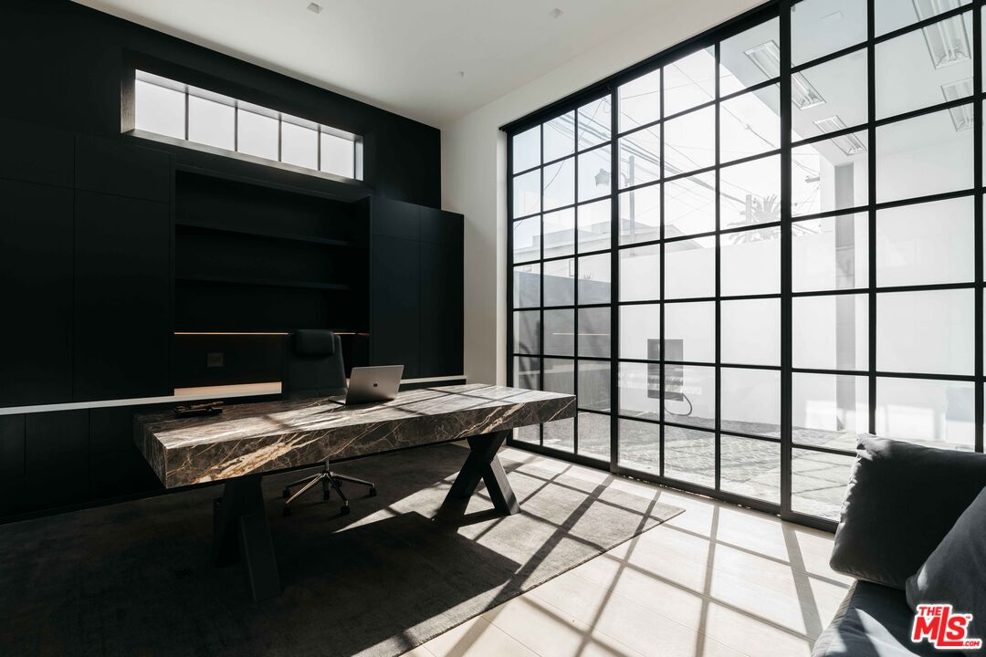 1346 Abbot Kinney Boulevard Venice, CA 90291 - Photo 4 of 18 a view of a workspace with furniture and a window