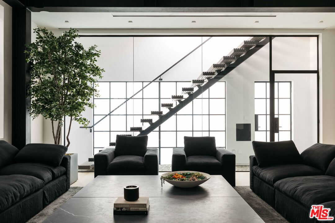 1346 Abbot Kinney Boulevard Venice, CA 90291 - Photo 5 of 18 a living room with furniture plant and a window