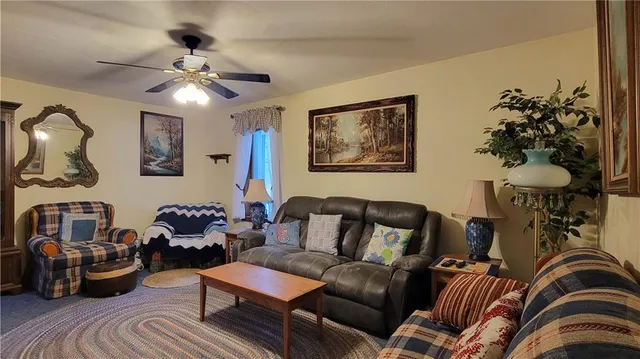 a living room with furniture and flowers