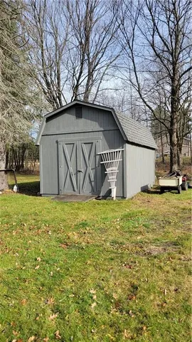 a street view with large trees