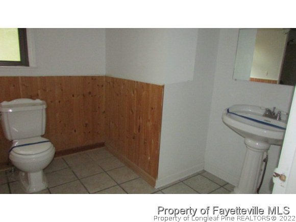710 King Street Rockingham, NC 28379 - Photo 3 of 7 a bathroom with a toilet and a sink