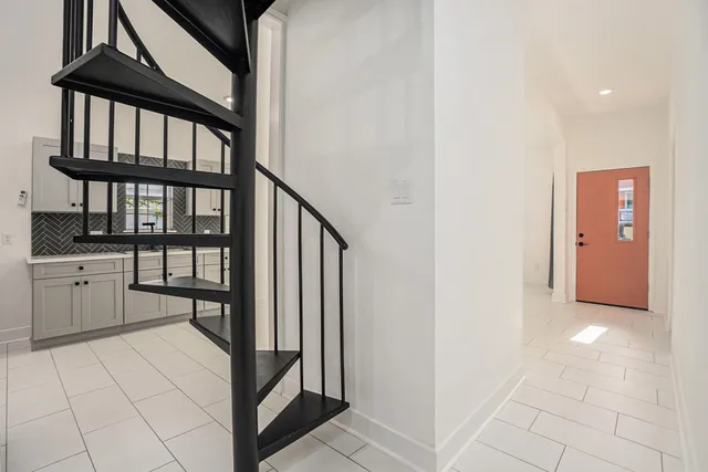 a view of a hallway with seating area