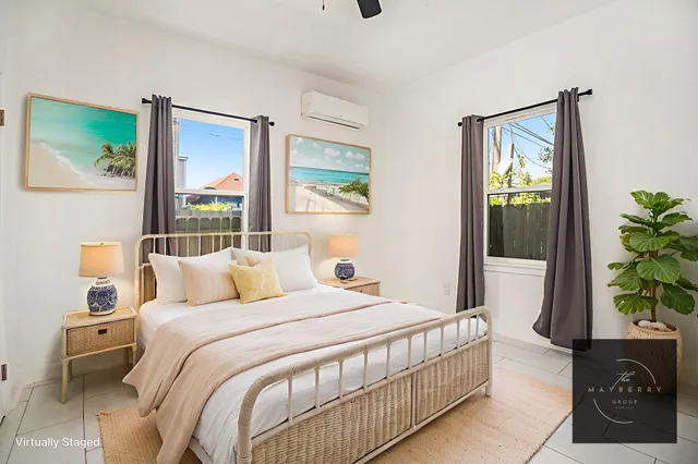 an empty room with a ceiling fan and carpet