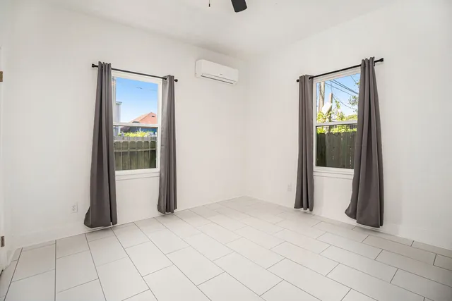 a bathroom with a sink vanity mirror and toilet