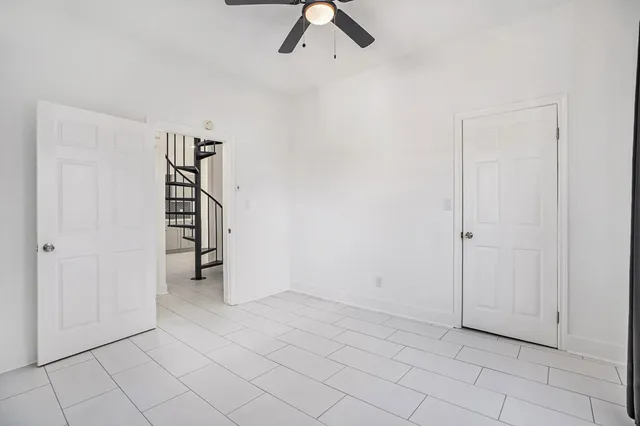 a bathroom with a sink vanity mirror and toilet