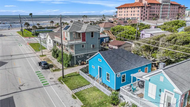 a aerial view of a house with a yard