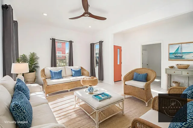 a living room with furniture rug and lamp