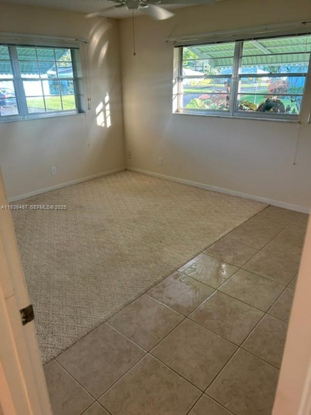 635 Hummingbird Lane Delray Beach, FL 33445 - Photo 15 of 21 an empty room with windows