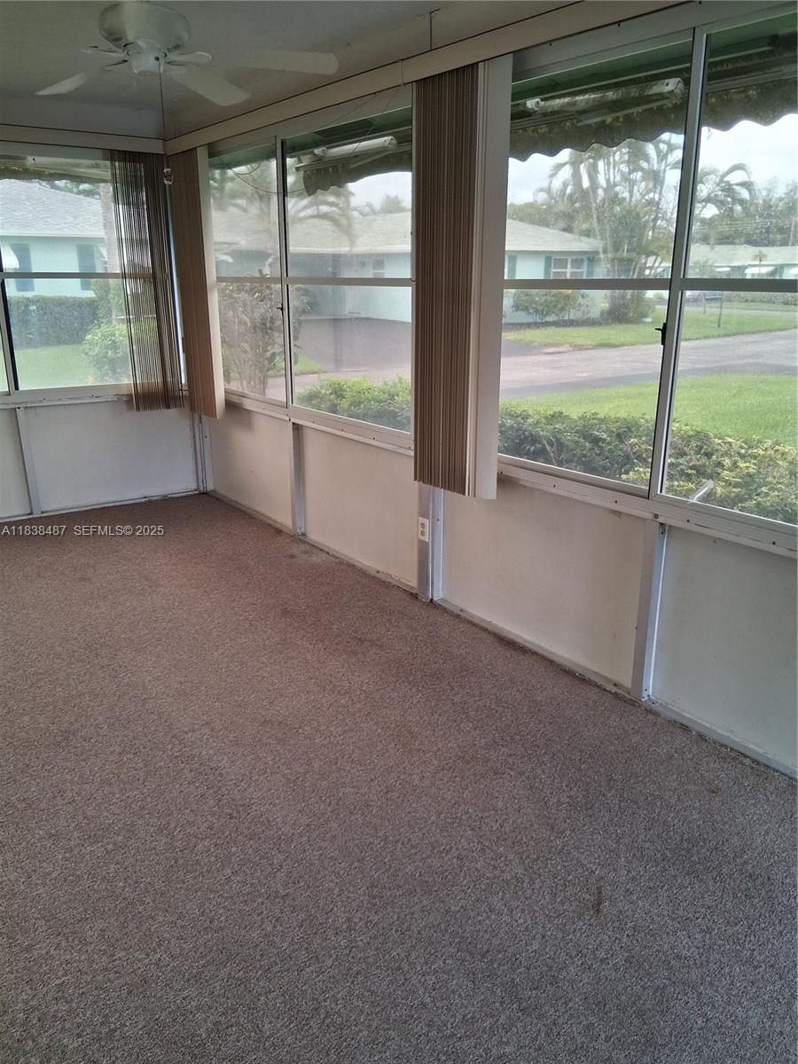 635 Hummingbird Lane Delray Beach, FL 33445 - Photo 19 of 21 a view of an empty room with a large window