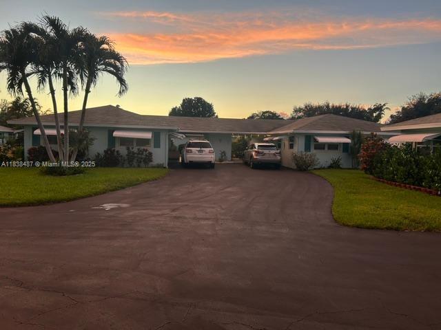 635 Hummingbird Lane Delray Beach, FL 33445 - Photo 21 of 21 a view of a big house with a big yard and palm trees