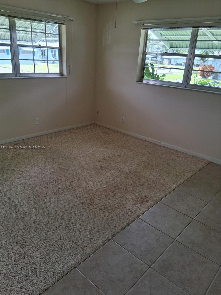 635 Hummingbird Lane Delray Beach, FL 33445 - Photo 9 of 21 an empty room with a window