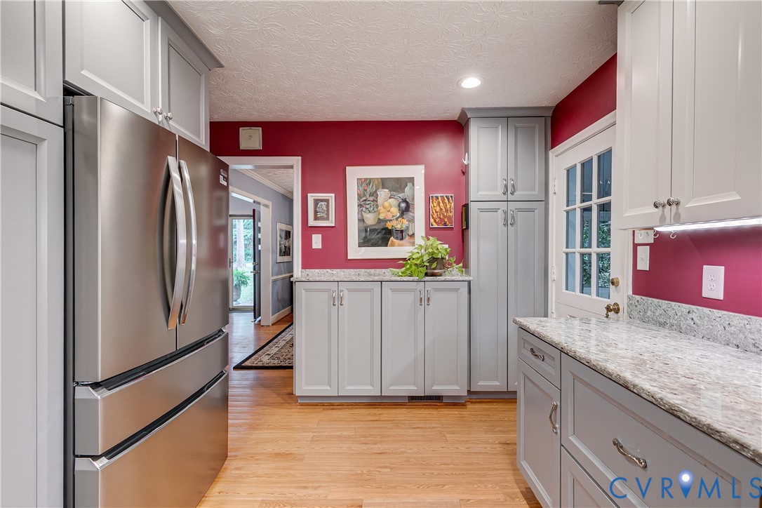 4411 Arrowhead Road Richmond, VA 23235 - Photo 18 of 33 a kitchen with stainless steel appliances granite countertop a refrigerator and a sink