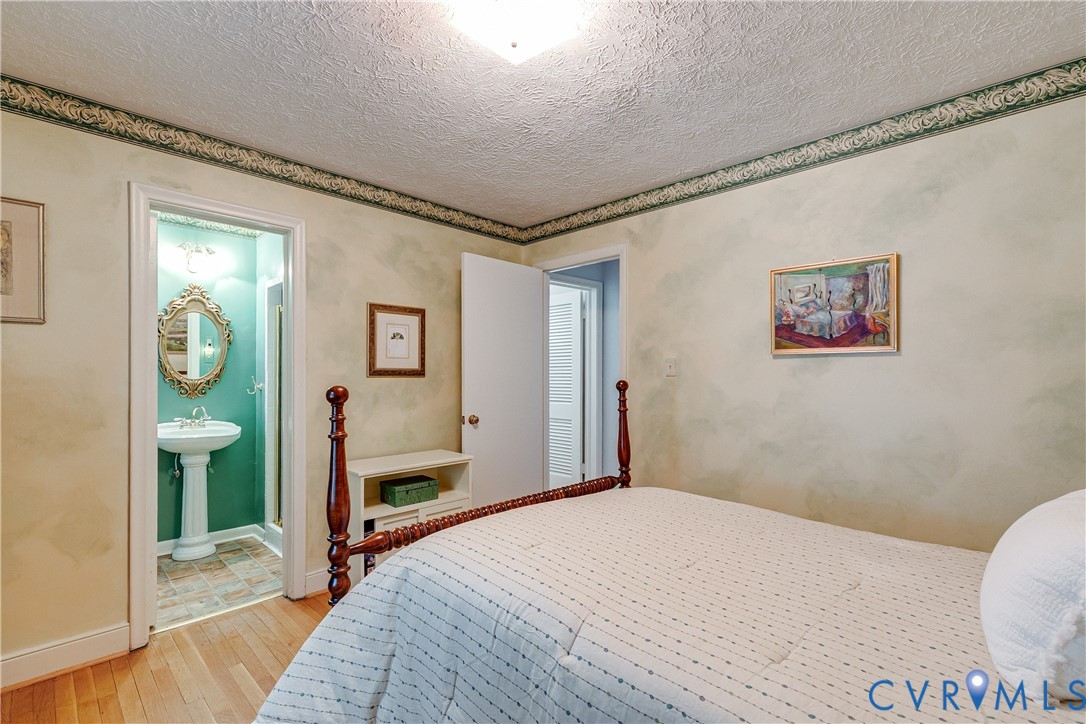 4411 Arrowhead Road Richmond, VA 23235 - Photo 20 of 33 a bedroom with a bed and a window