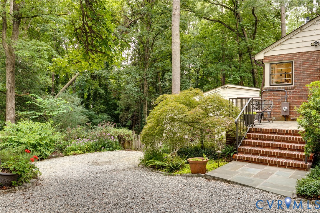 4411 Arrowhead Road Richmond, VA 23235 - Photo 2 of 33 a view of a garden with large trees