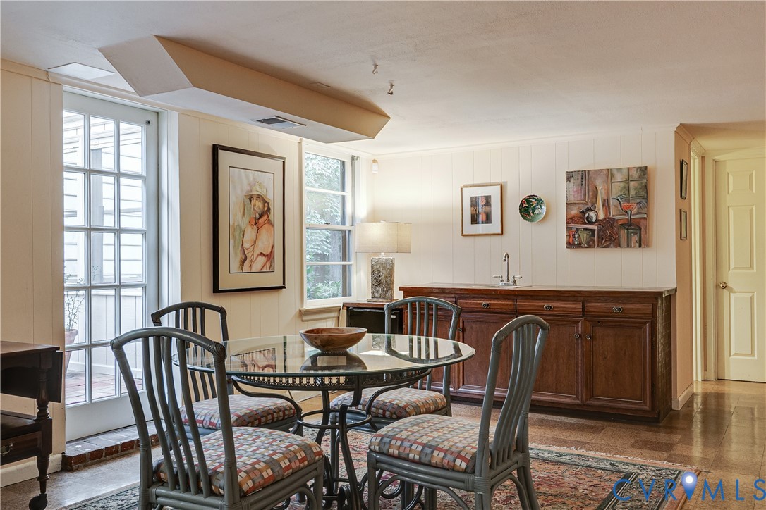 4411 Arrowhead Road Richmond, VA 23235 - Photo 30 of 33 a view of a dining room with furniture window and wooden floor