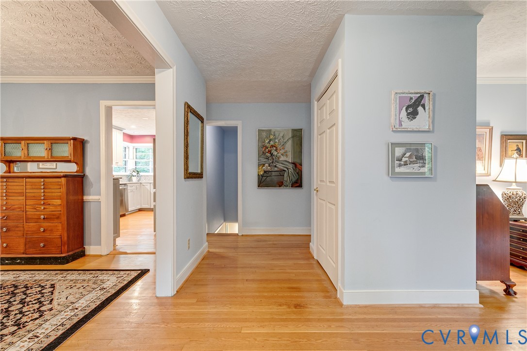 4411 Arrowhead Road Richmond, VA 23235 - Photo 8 of 33 a view of a hallway with wooden floor and windows