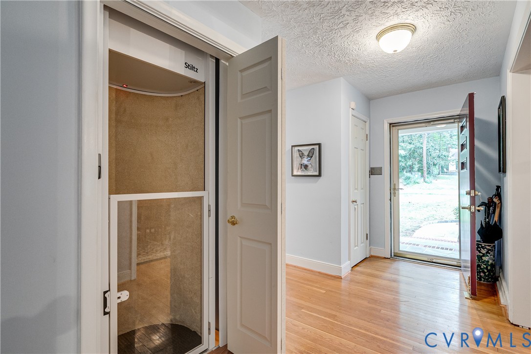 4411 Arrowhead Road Richmond, VA 23235 - Photo 9 of 33 a view of a hallway with wooden floor