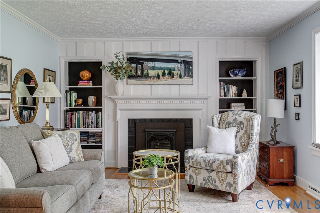 4411 Arrowhead Road Richmond, VA 23235 - Photo 10 of 33 a living room with furniture and a fireplace