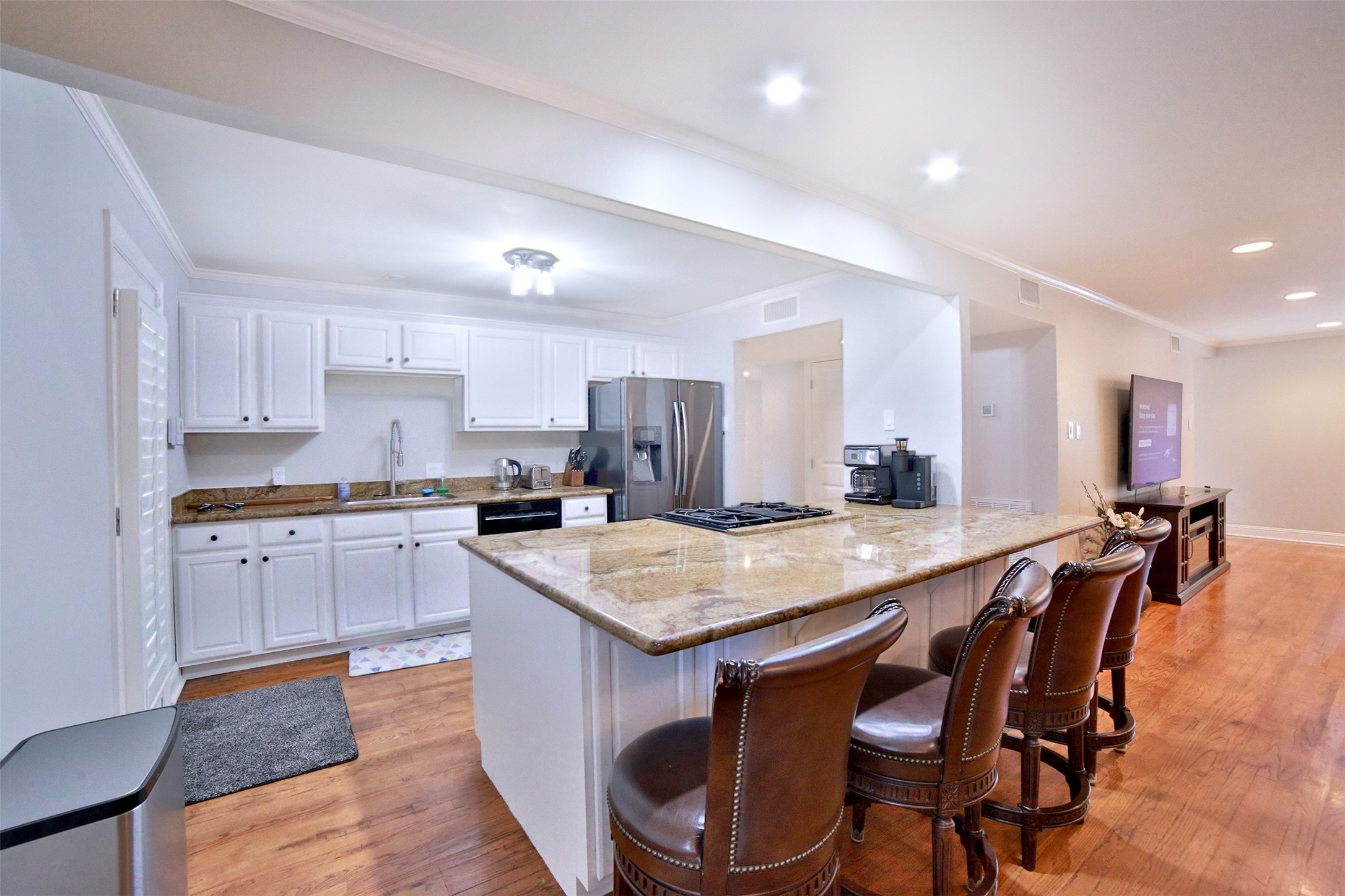 2625 Peckham Street Houston, TX 77098 - Photo 7 of 27 a kitchen with a stove a sink and a refrigerator