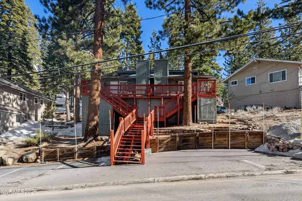 a view of a house with iron stairs