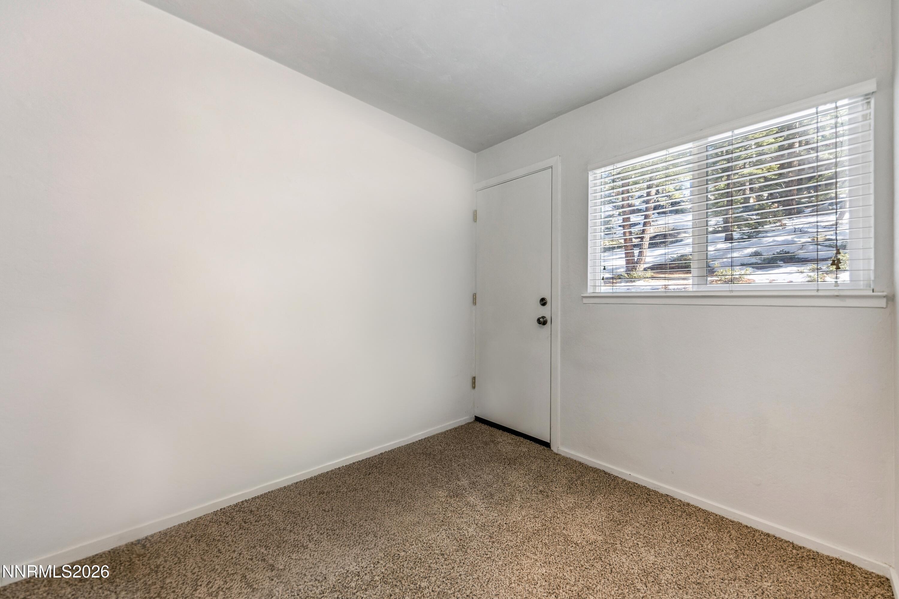 219 South Benjamin Drive, Unit B Stateline, NV 89449 - Photo 12 of 22 an empty room with a window