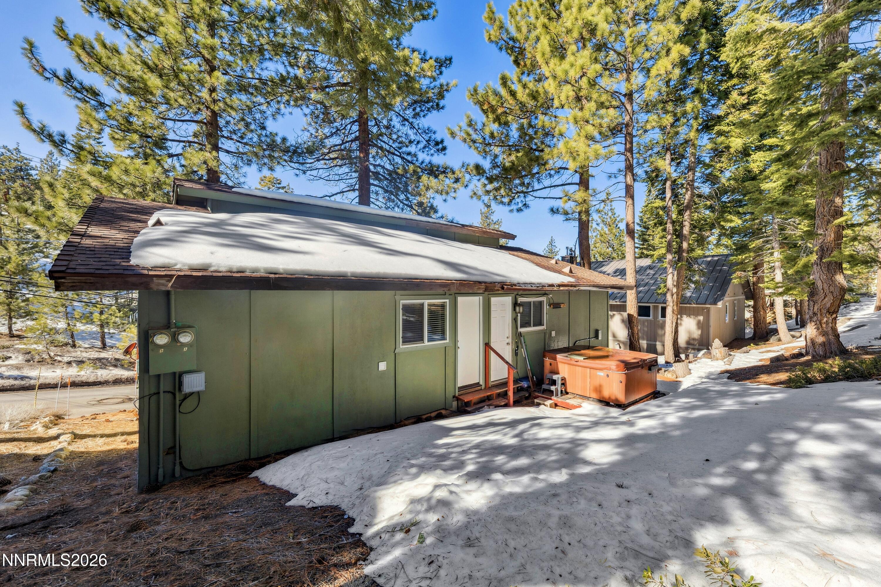 219 South Benjamin Drive, Unit B Stateline, NV 89449 - Photo 15 of 22 a view of a house with backyard porch and sitting area