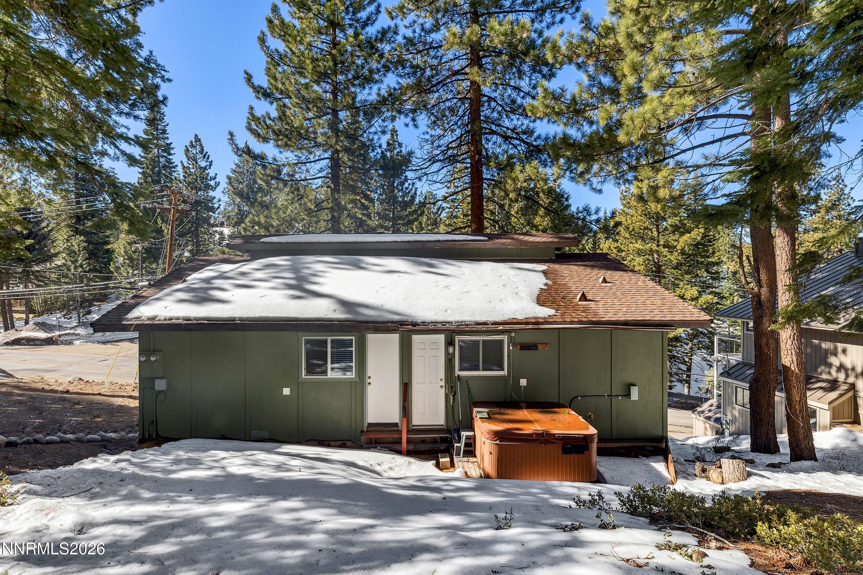 219 South Benjamin Drive, Unit B Stateline, NV 89449 - Photo 16 of 22 a front view of a house with a garden
