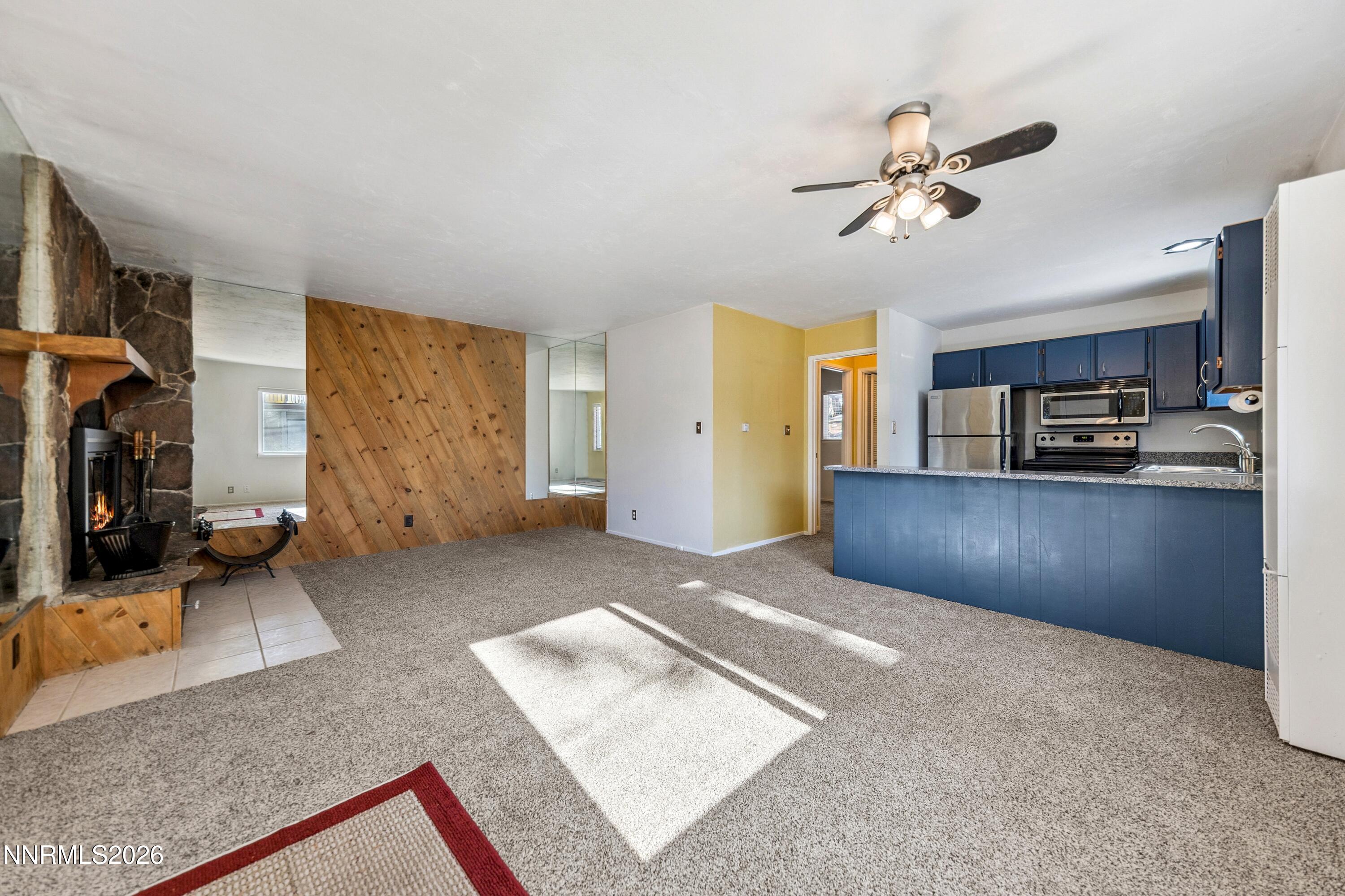 219 South Benjamin Drive, Unit B Stateline, NV 89449 - Photo 4 of 22 a view of a livingroom with furniture and a kitchen
