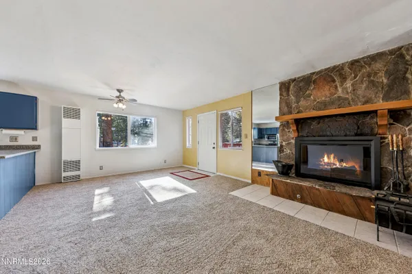 a view of empty room with a fireplace