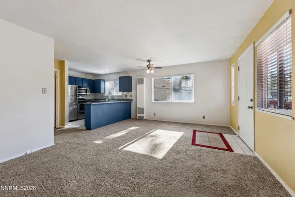 a view of a kitchen with a sink cabinets and a window