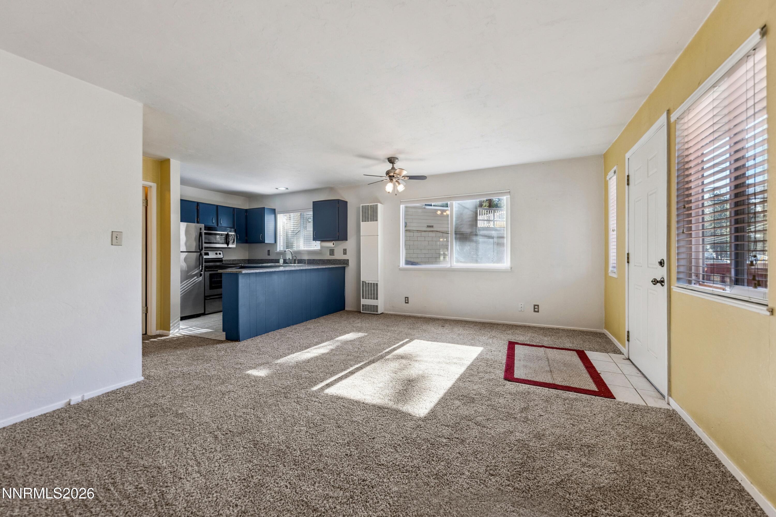 219 South Benjamin Drive, Unit B Stateline, NV 89449 - Photo 8 of 22 a view of a kitchen with a sink cabinets and a window