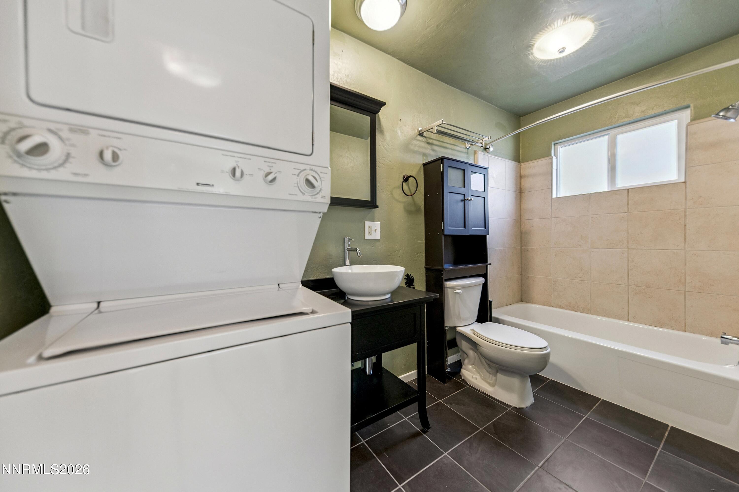 219 South Benjamin Drive, Unit B Stateline, NV 89449 - Photo 10 of 22 a bathroom with a sink toilet and shower