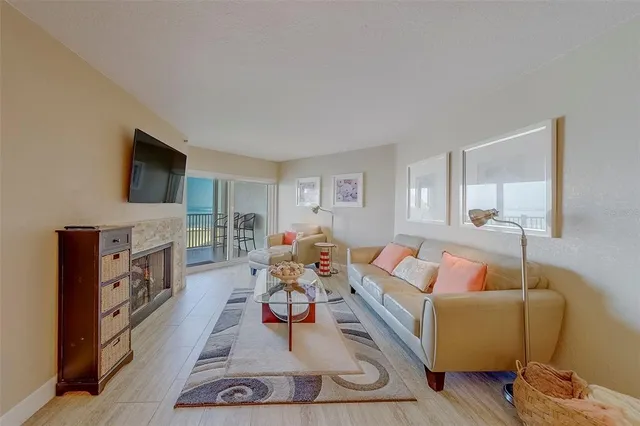 a living room with furniture fireplace and a flat screen tv