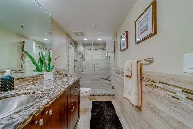 a view of a chairs and table in patio