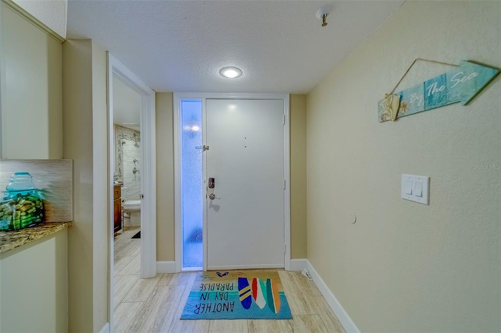17980 Gulf Boulevard, Unit 402 Redington Shores, FL 33708 - Photo 4 of 63 a view of room with window and hardwood