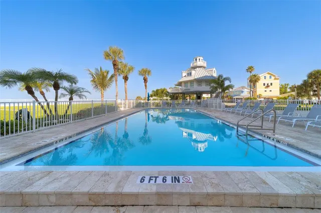 an aerial view of a house with a swimming pool
