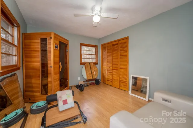 a bedroom with furniture and a window