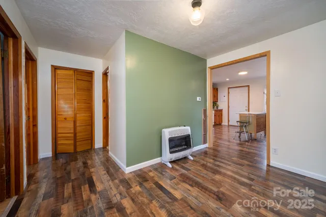 a view of livingroom with hardwood floor and a ceiling fan