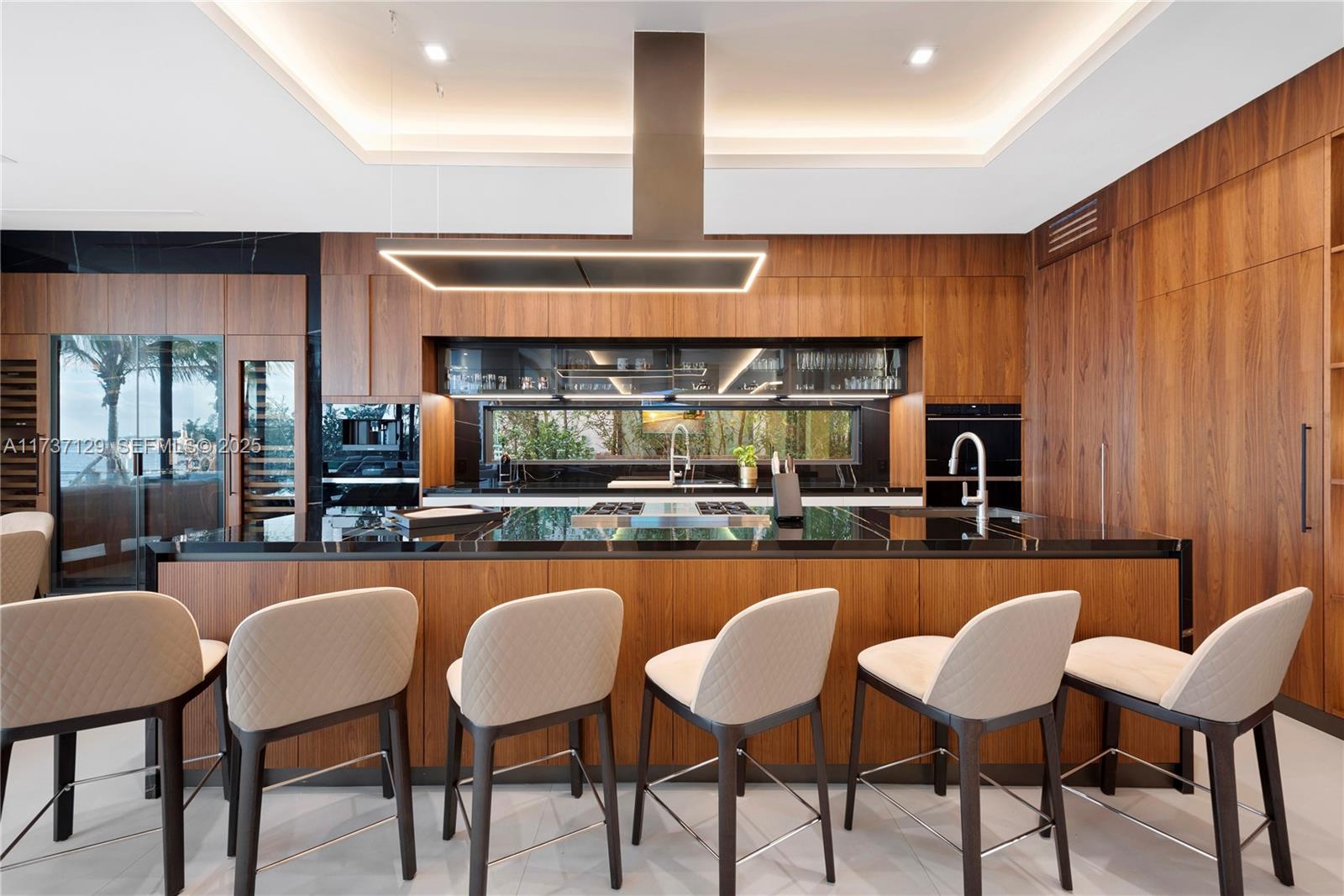 1785 Cleveland Road Miami Beach, FL 33141 - Photo 20 of 67 a kitchen with stainless steel appliances granite countertop a table chairs sink and cabinets