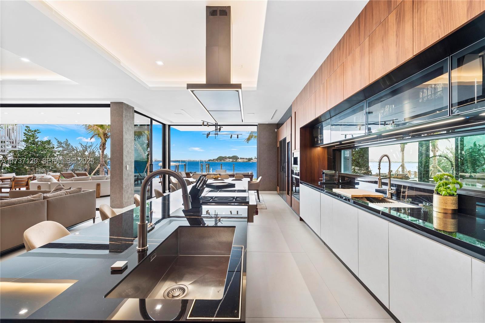 1785 Cleveland Road Miami Beach, FL 33141 - Photo 22 of 67 a kitchen with stainless steel appliances kitchen island granite countertop a sink and counter space